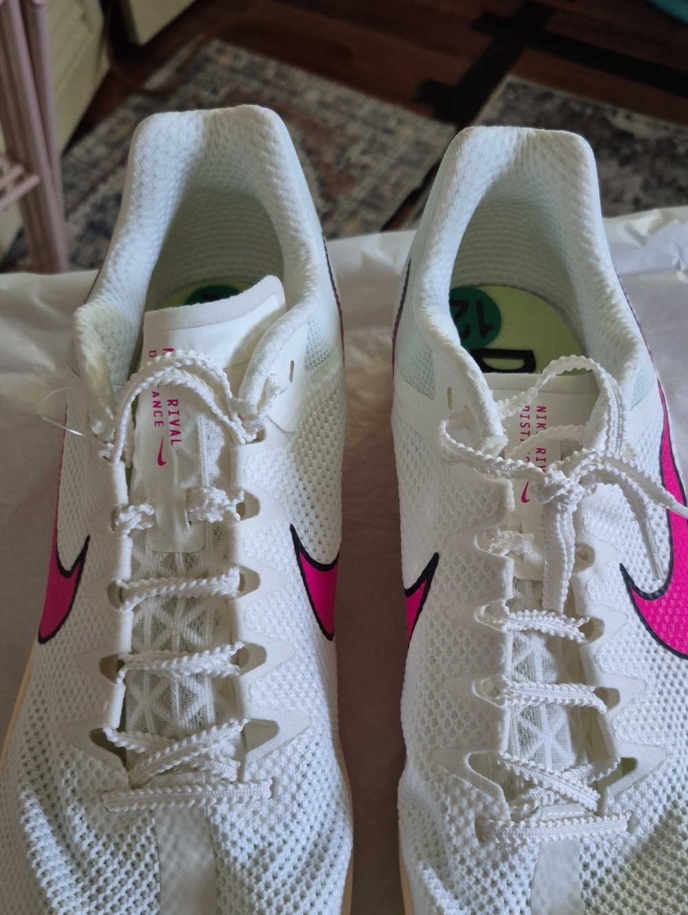 Nike White Athletic Shoes with Pink Swoosh